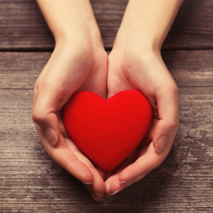 Hands Holding a Heart for Life Insurance in Menifee, CA