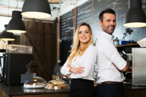 Woman and Man Standing Smiling with Commercial Insurance in Murrieta, CA