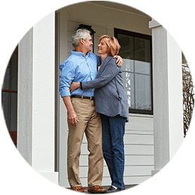 Couple Standing on Porch of Home with Home Insurance in Lake Elsinore, Murrieta, Temecula, Wildomar, Winchester