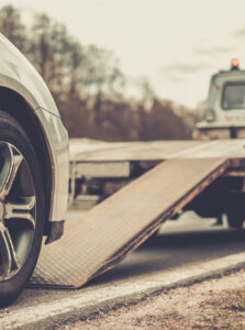 Car Getting Towed on Tow Truck with Car Insurance in Lake Elsinore, Murrieta, Temecula, Wildomar, Winchester