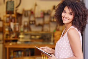 Woman Business Owner Smiling with Commercial Insurance in Winchester, CA